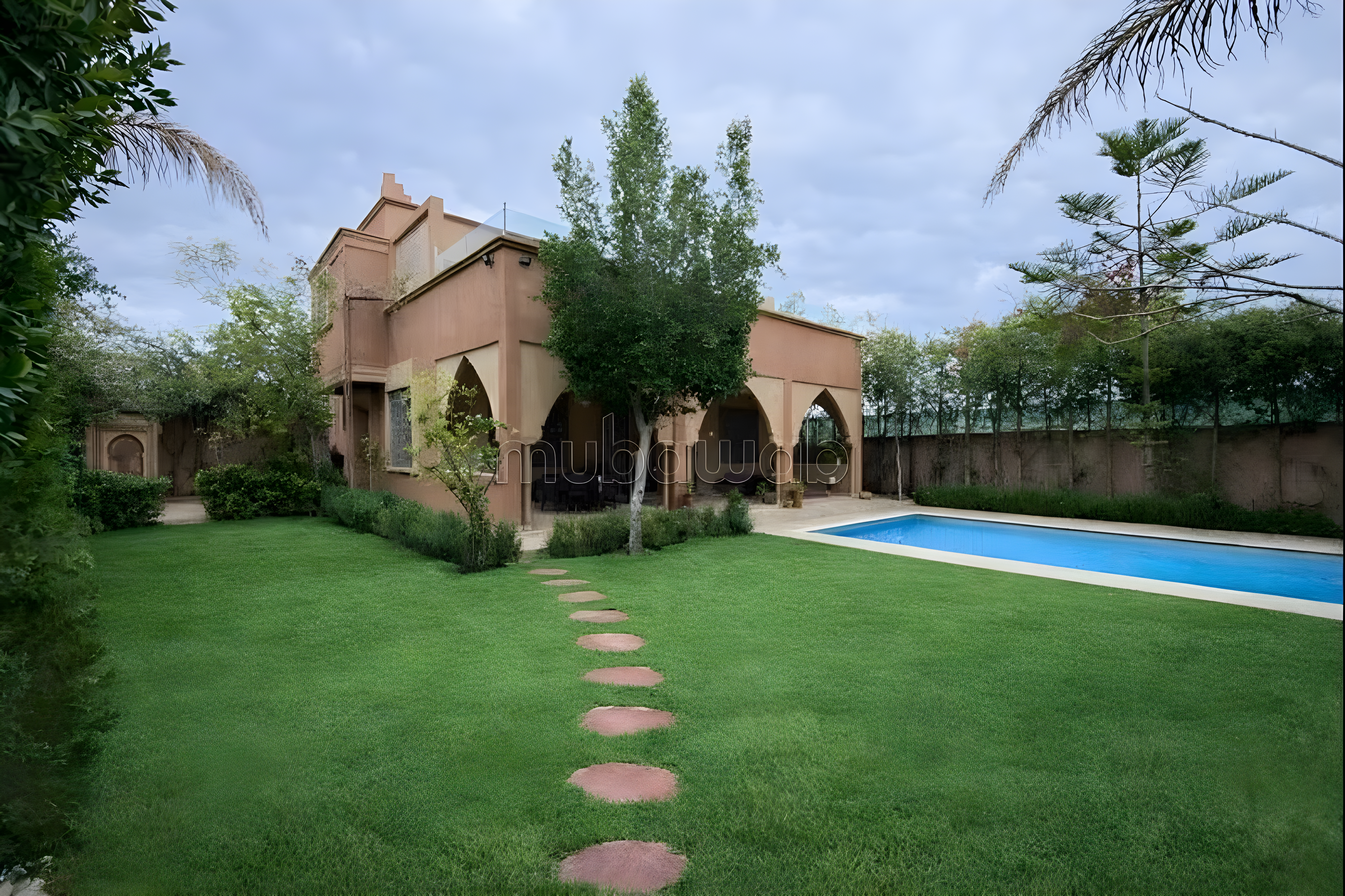 Courtyard with pool, lawn, and Moroccan guesthouse in Route De L'Ourika.