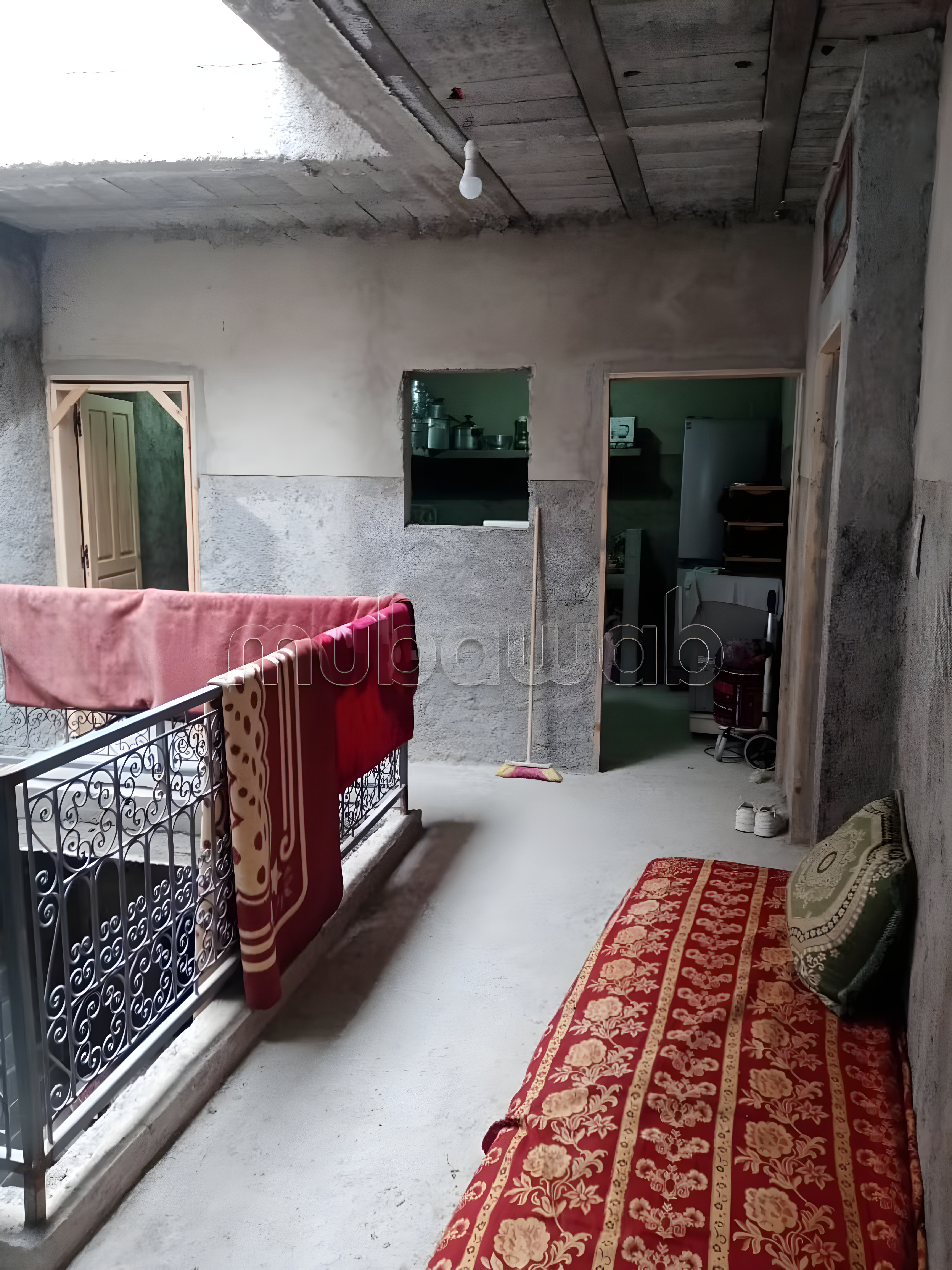 Terrace with seating and a railing in Zaouiat Lahdar.