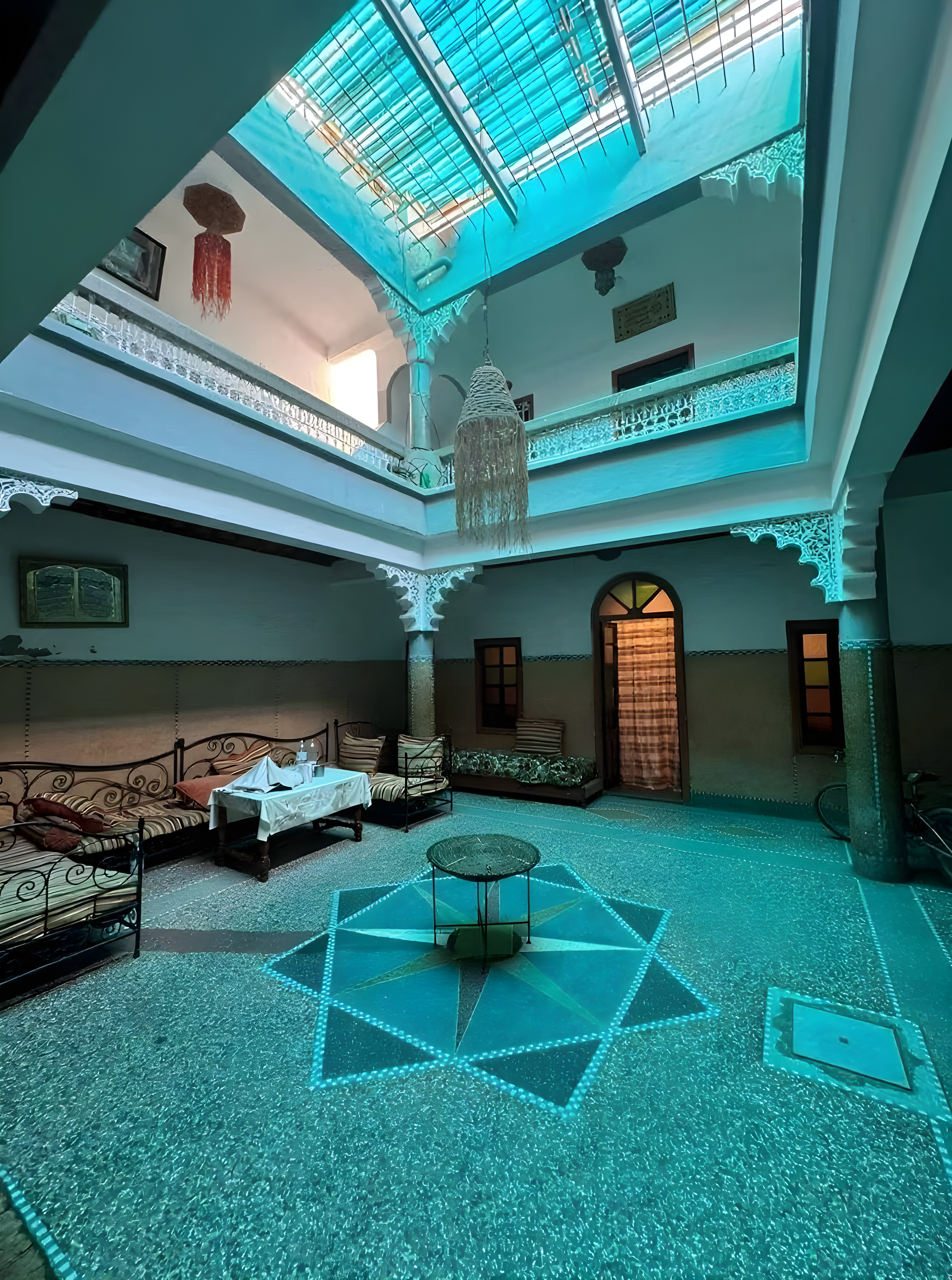 Moroccan courtyard with tiled floor and canopy in Kaa El Machraa.