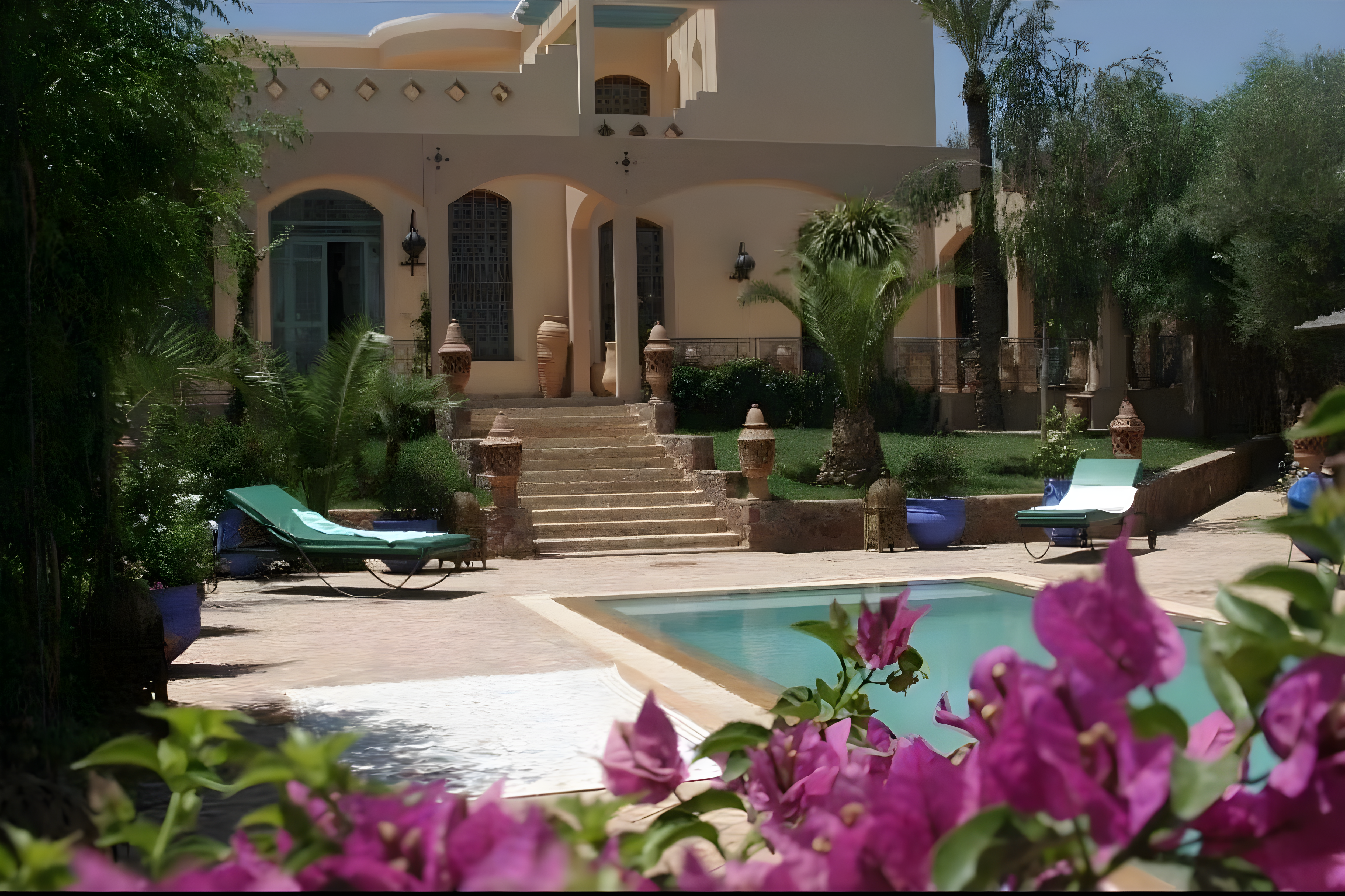 Guesthouse courtyard with pool and greenery on Route De L'ourika.